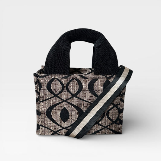 Handbag with black and beige pattern on a white background