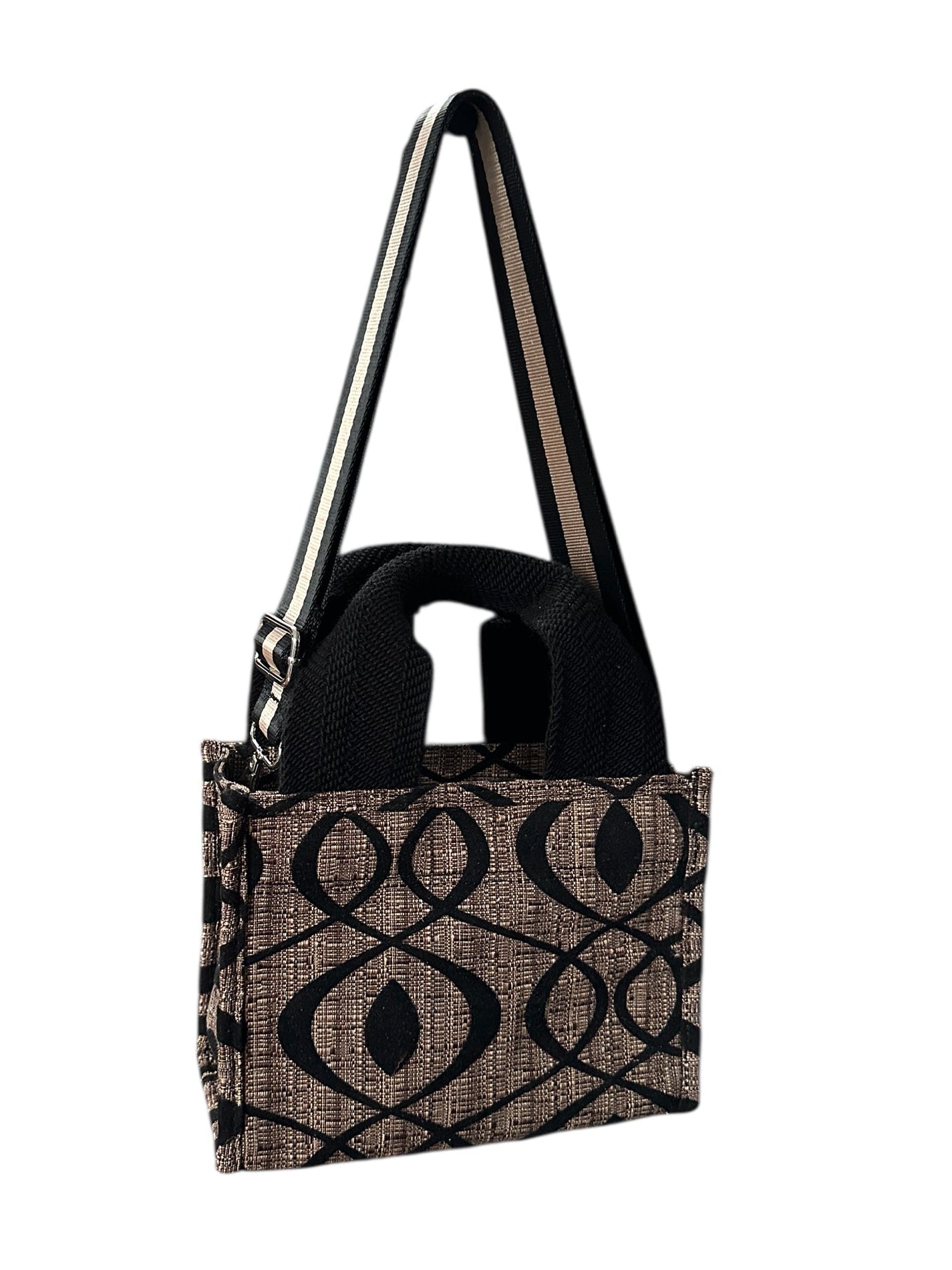 Black and brown patterned handbag on a white background