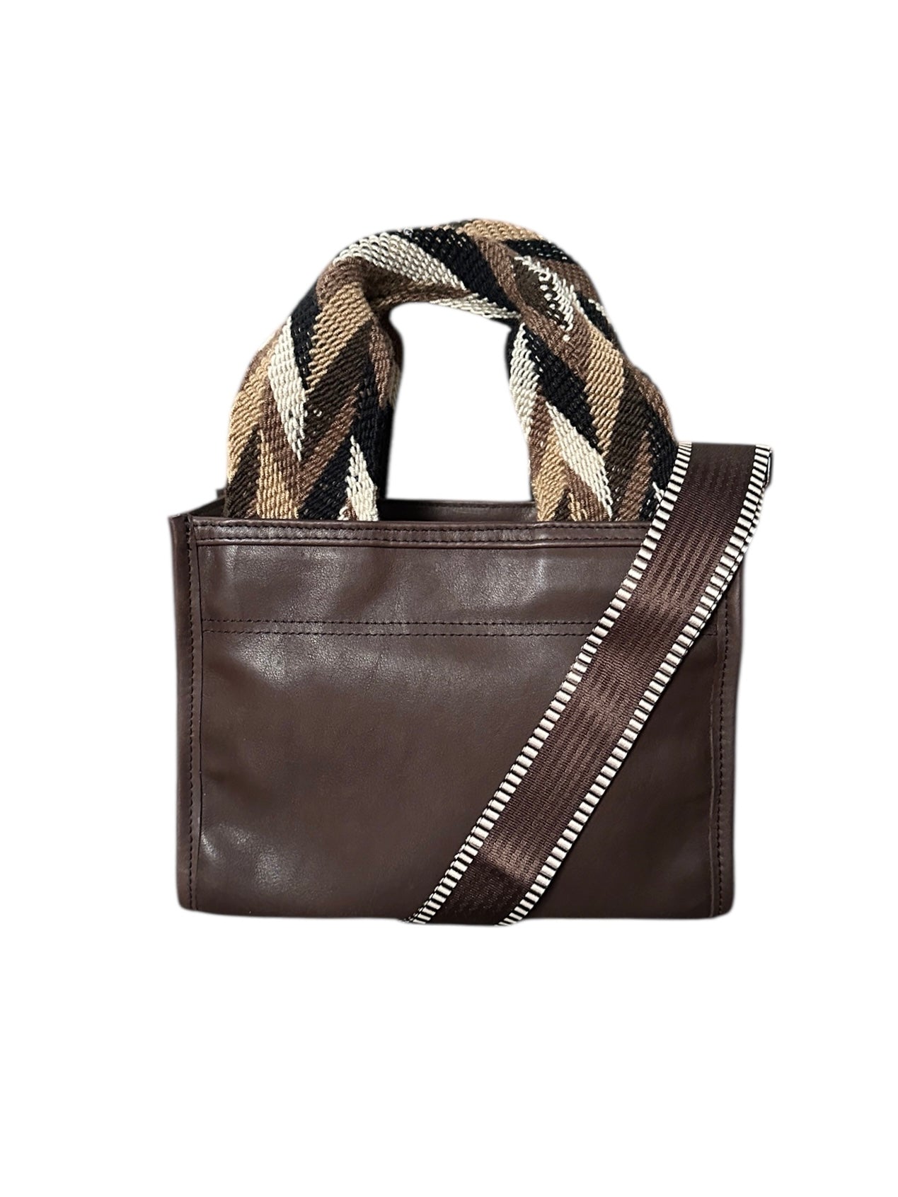 Brown leather handbag with a geometric  patterned handle on a white background