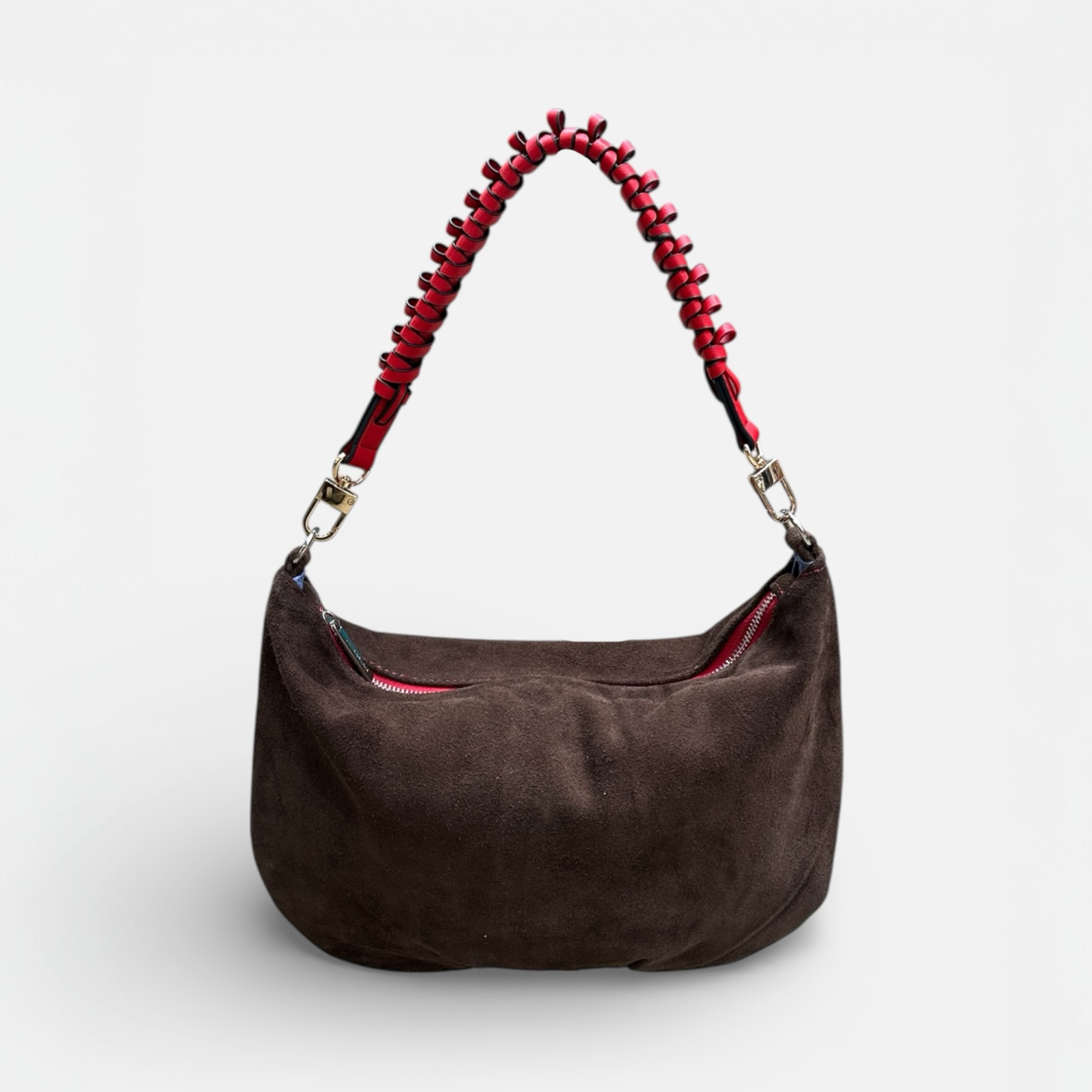Brown handbag with a red beaded handle on a white background