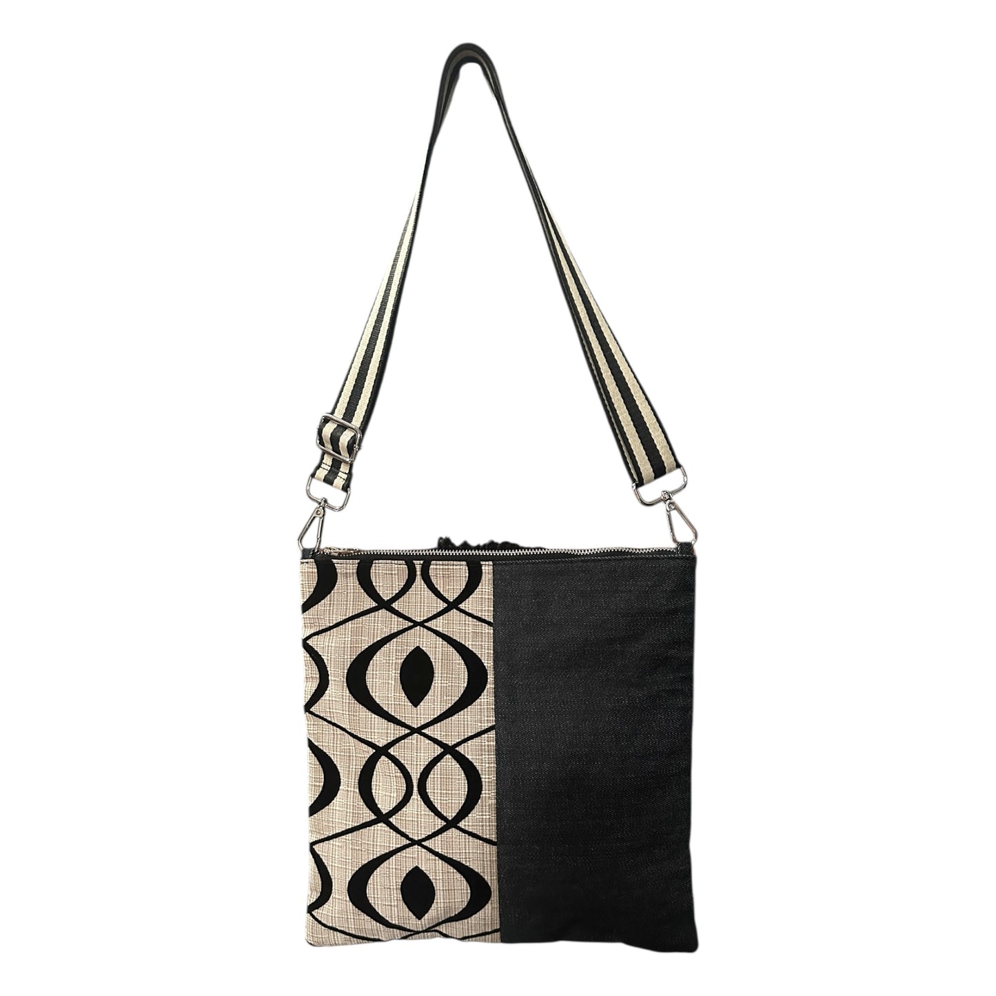 Minimalist cream and black crossbody bag worn crossbody