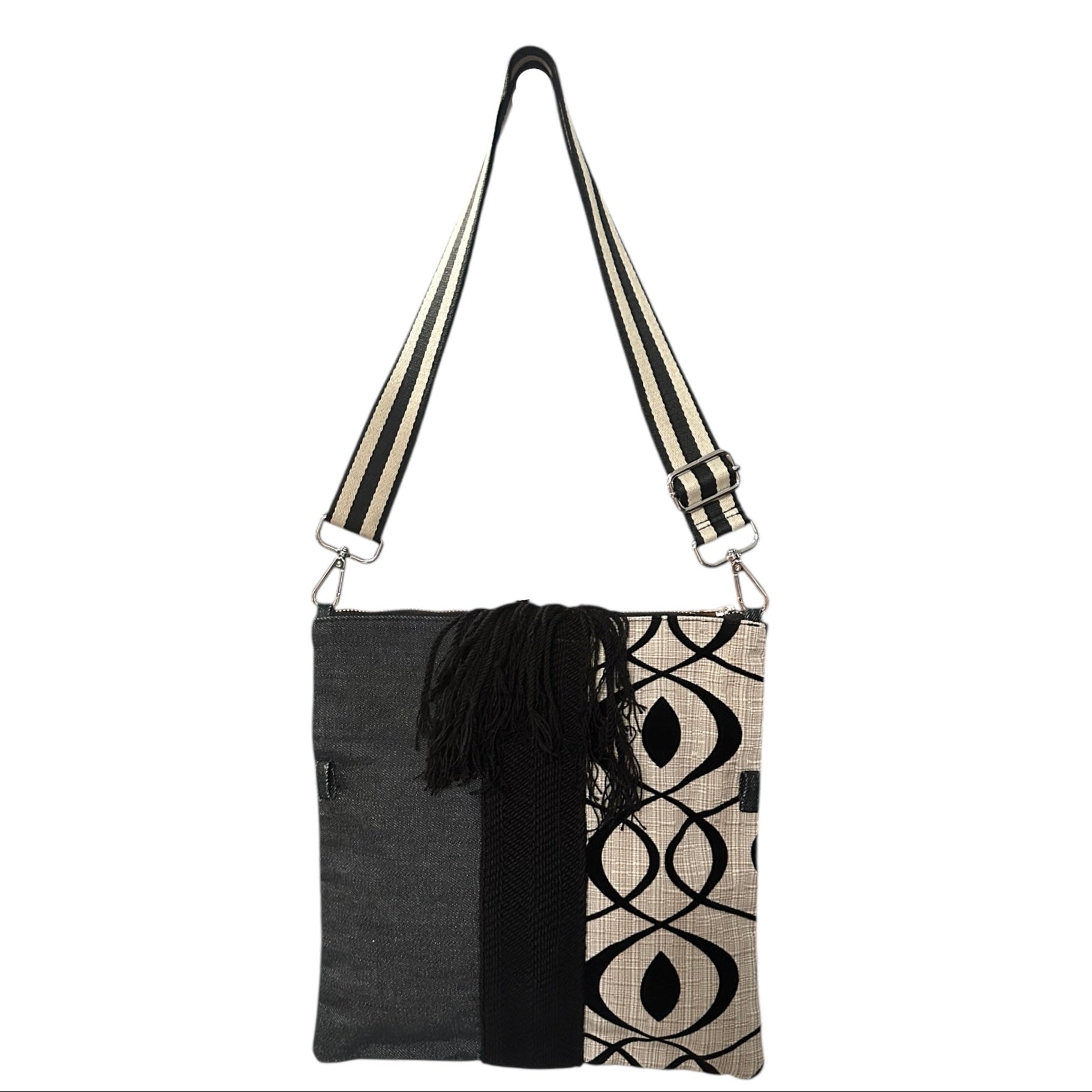 Cream and black crossbody bag with modern silhouette