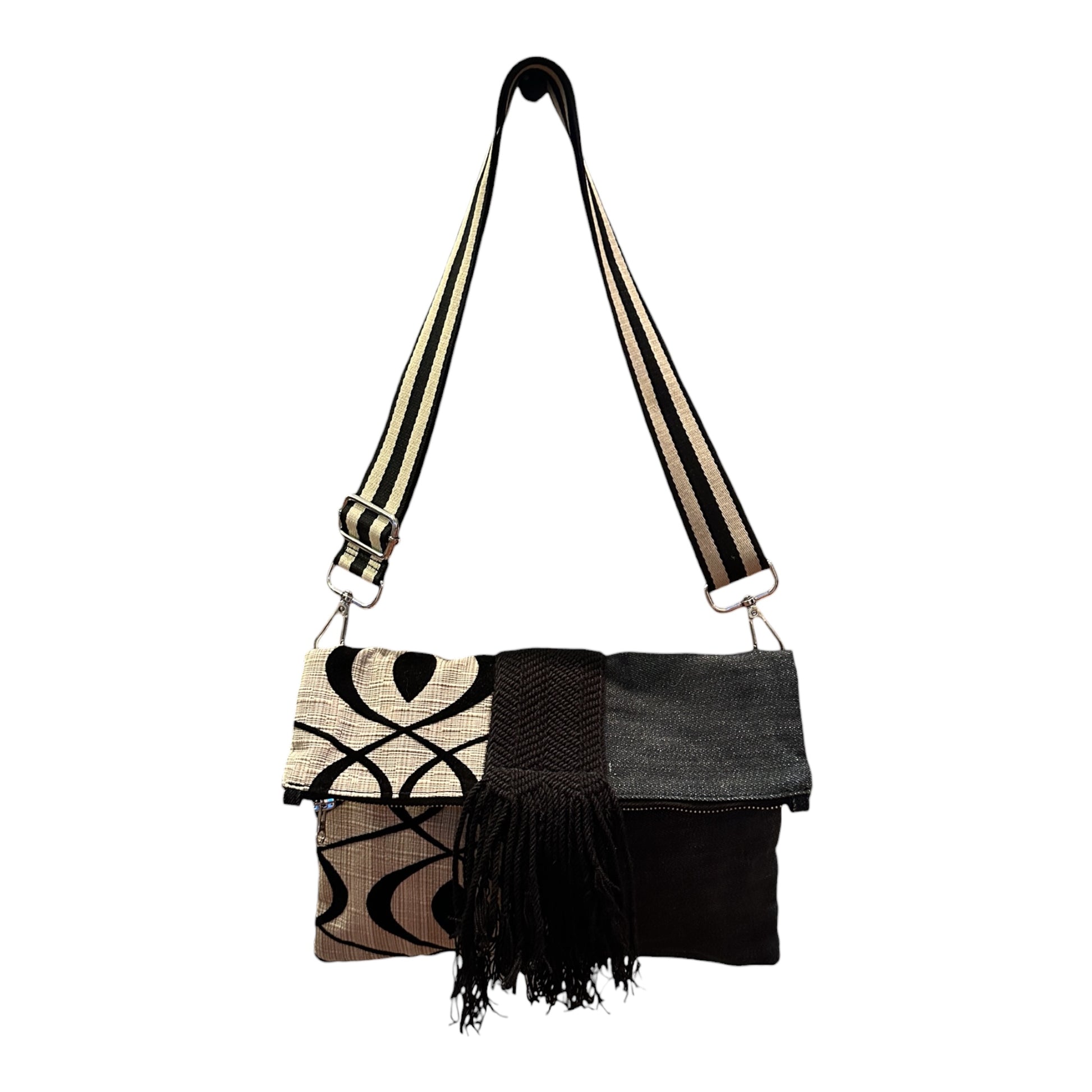 Cream and black crossbody bag with zip-top closure