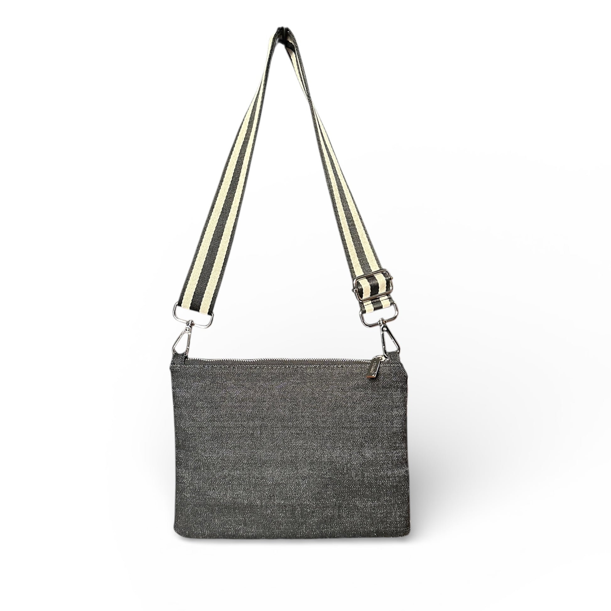 Gray crossbody bag with striped strap on a white background