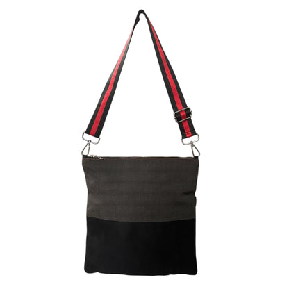 Black faux suede crossbody bag with adjustable strap and pinstripe pattern