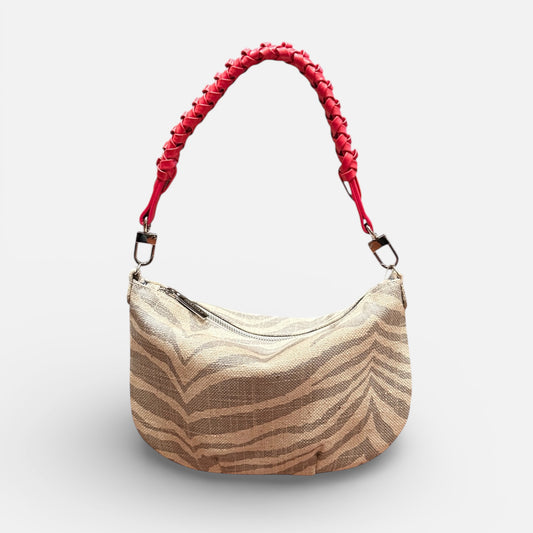 Beige handbag with red handle on a white background