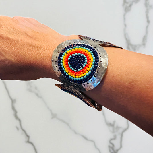 Multicolor and metal cuff bracelet on arm