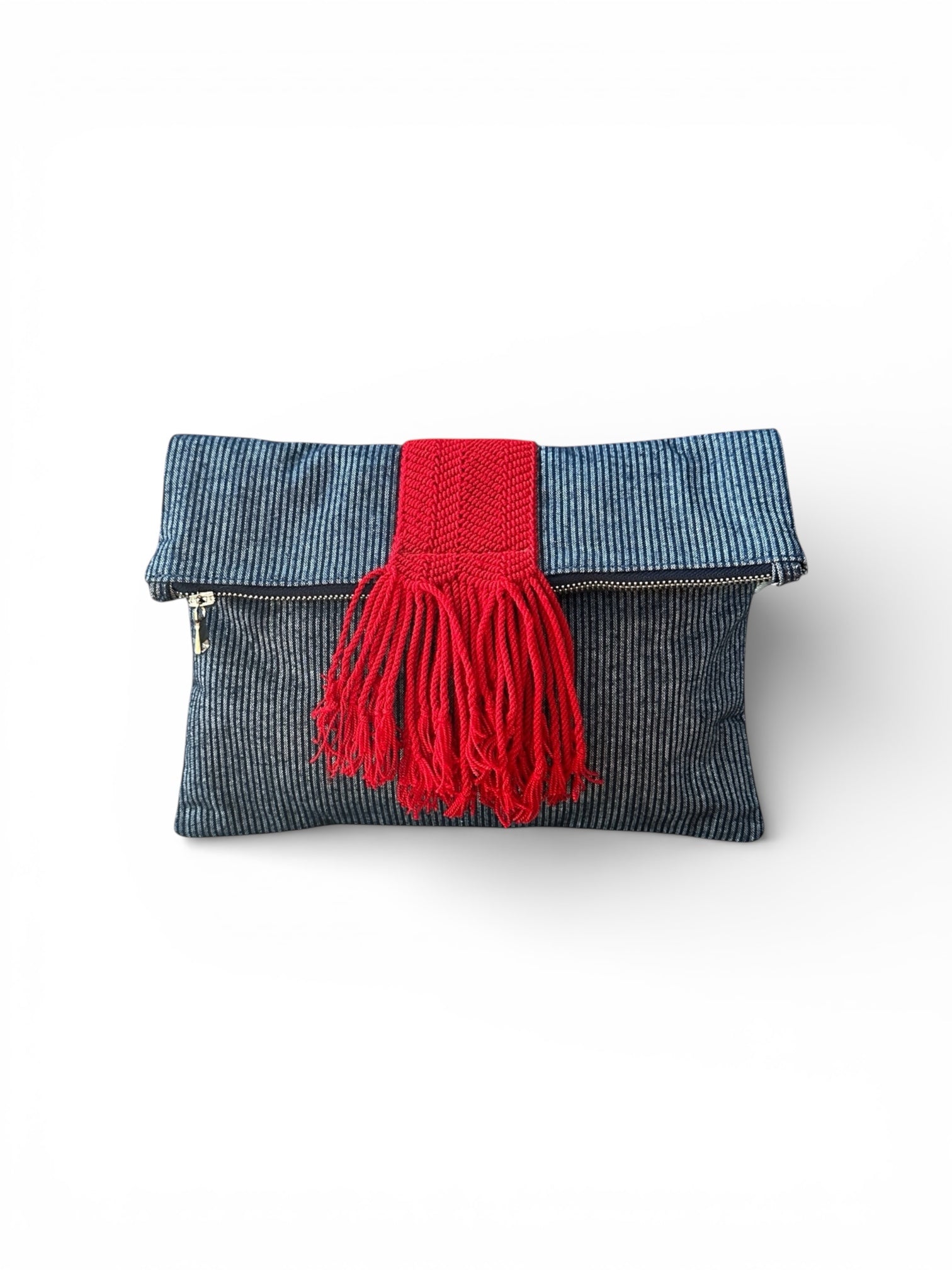 Navy denim pinstripe clutch bag with red accent details
