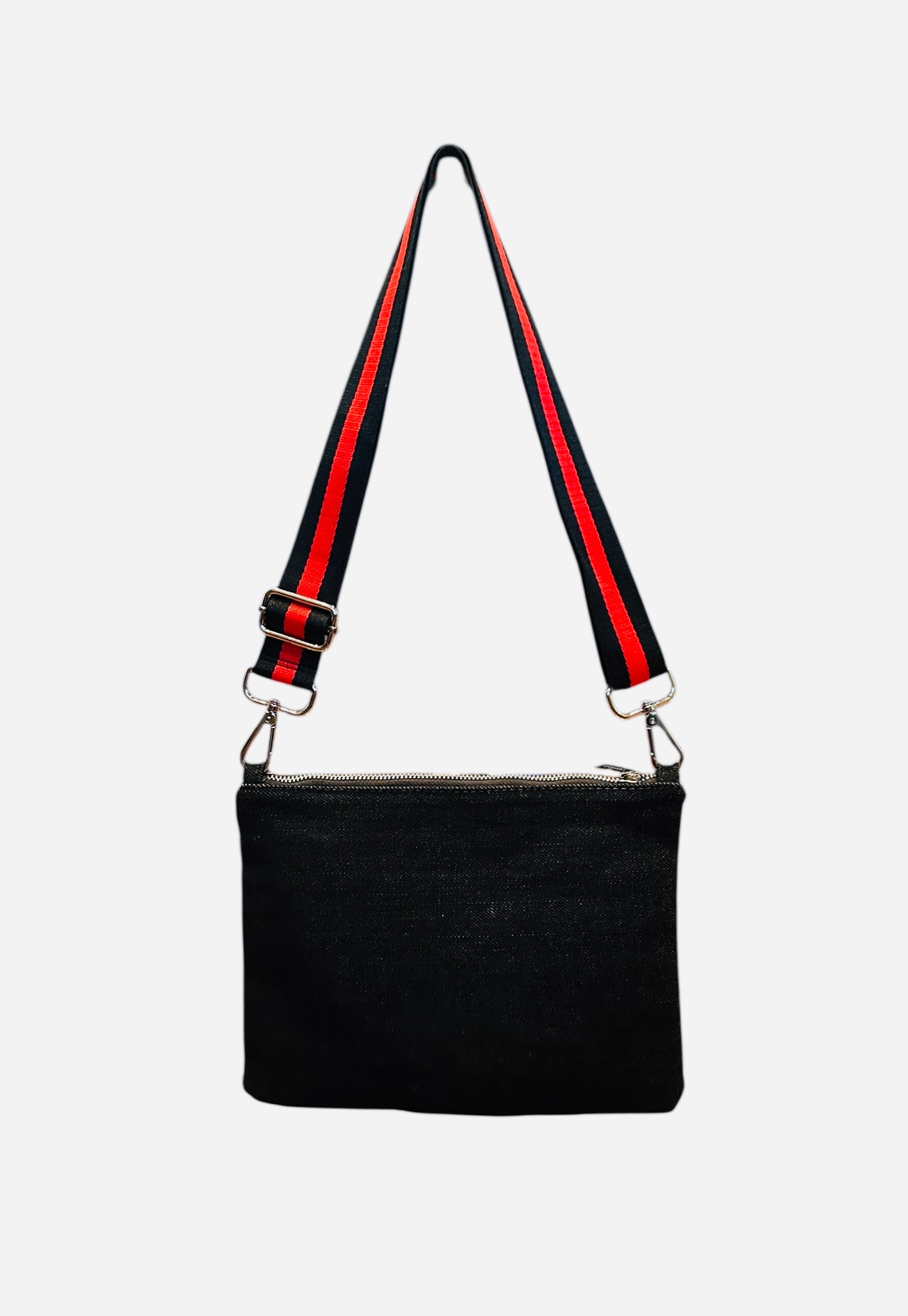 Black handbag with red and black striped strap on a white background