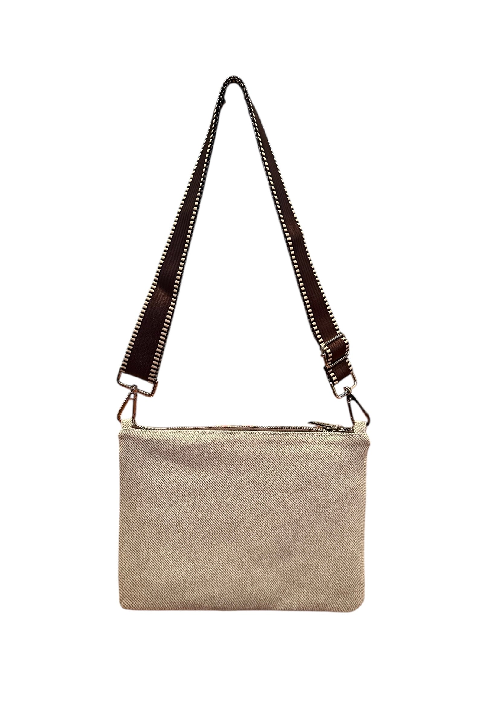 Beige crossbody bag with a black strap on a white background
