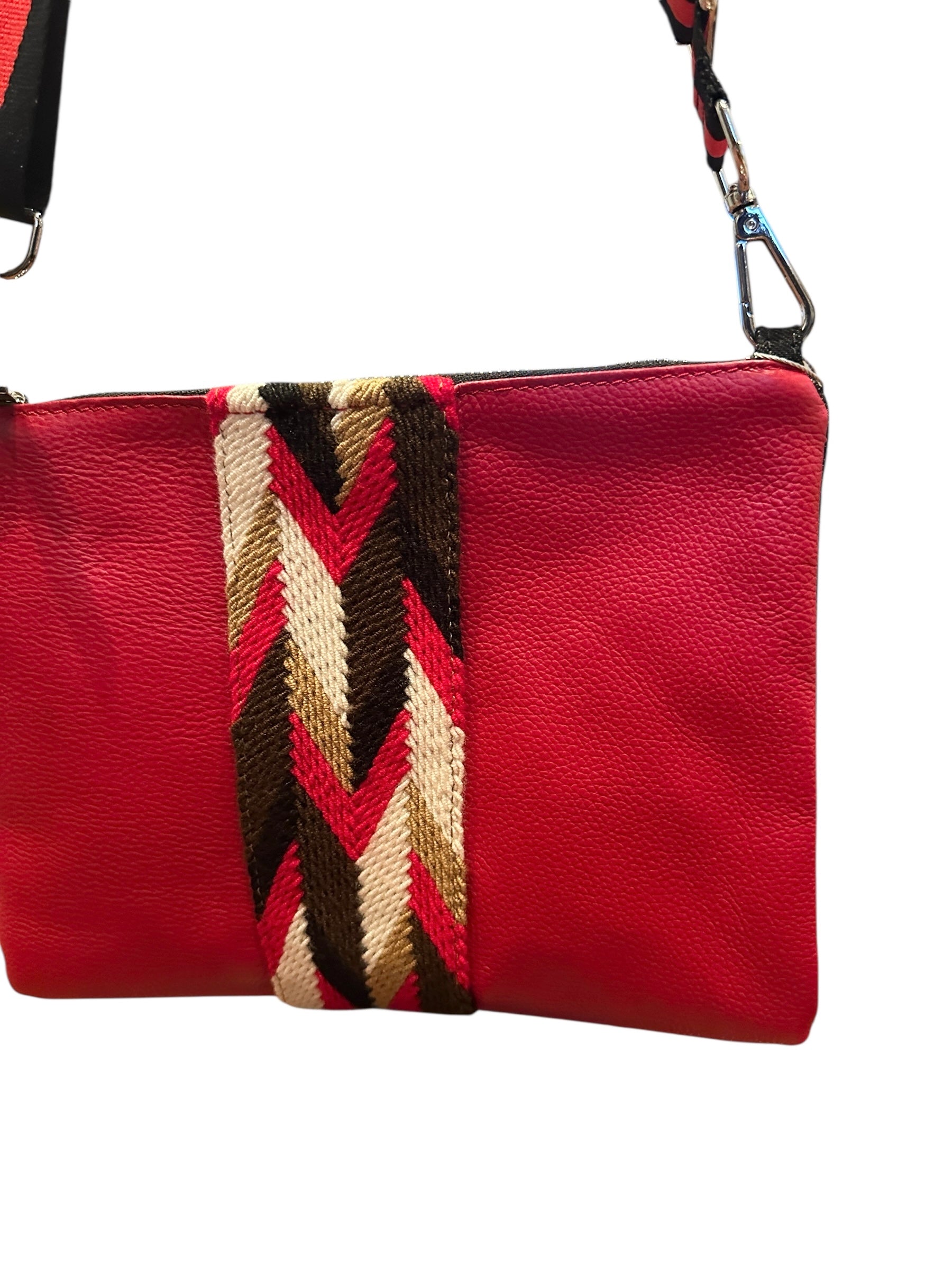 Red leather clutch with a colorful woven pattern on a white background